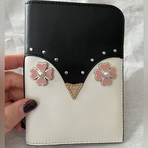 Kate Spade Black and White Penguin Passport Holder with Pink Flower Accents